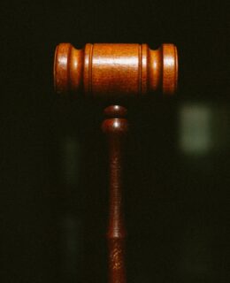 brown wooden pipe in dark room