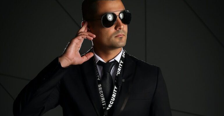 man in black suit wearing black sunglasses