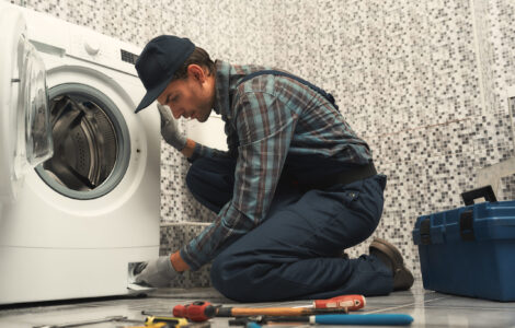 High quality workmanship. Plumber repairing washing machine