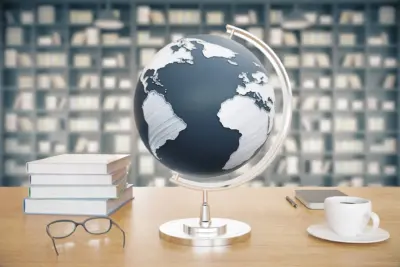 wooden-desktop-with-globe-coffee-books-and-glass-2026-01-11-08-47-12-utc